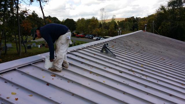 Jorge preparing to start coating the roof