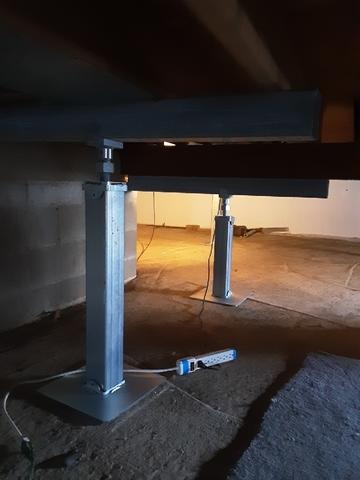 These are two more of the SmartJacks beautifully installed in this crawl space to uphold the floor joists.