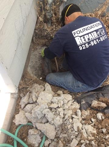 A crew member preps the foundation for the push pier to be installed beneath it.