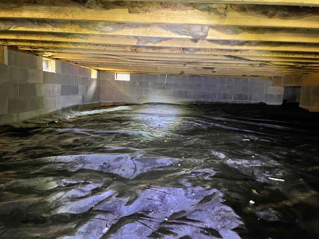 There were many gaps in the existing vapor barrier of this crawl space. These gaps and holes allow the earth's moisture to rise into the crawl space and affect the relative humidity. The rise in relative humidity can lead to condensation, moisture damage, and mold growth.