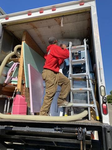 Getting ready to blow insulation from they work truck