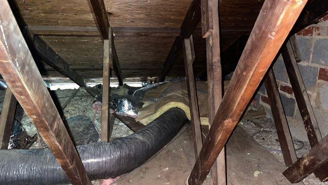 Although it is wrapped, this duct should be buried in insulation to better protect it from the heat/cool in the attic.  The thin layer of insulation in this attic tells us that the home and rooms below are not able to keep the conditioned air made by the HVAC system.