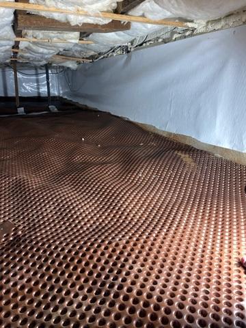 Our crew is in the process of installing our drainage matting.