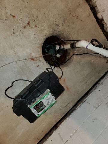 Here is the sump pump before our crew installed our TripleSafe Sump Pump System.