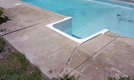 Cracks around stairs of pool