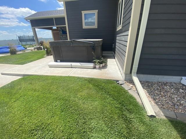 Before photo of the concrete settling. You can see there is a large unsealed joint nearest the home, which could allow water into the home.