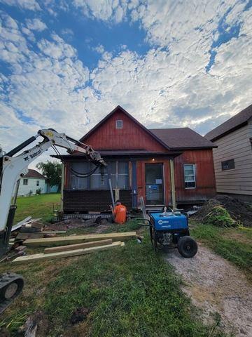 Helical Piers Driven into Ground to Lift Cabin