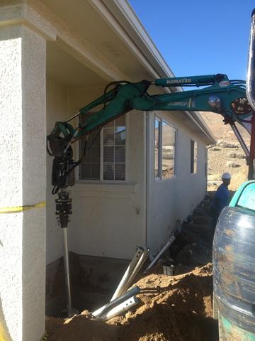 Helical Piers are installed to support foundation