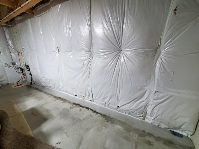 These homeowners had this insulation installed, in hopes of keeping the home at the correct temperature. This insulation is not waterproof though, so mold has started to form on the backside of it.