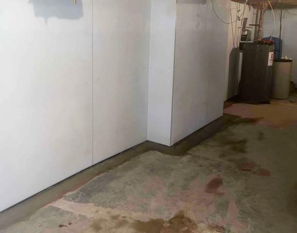 The WaterGuard floor drainage system was installed on top of the footer around the perimeter of the basement and the Bright Wall Panels help redirect the water to a sump pump.