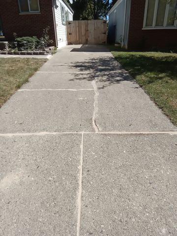 Westland, Mi Concrete Driveway Cleaned and Joints Sealed w/ Crack Repair