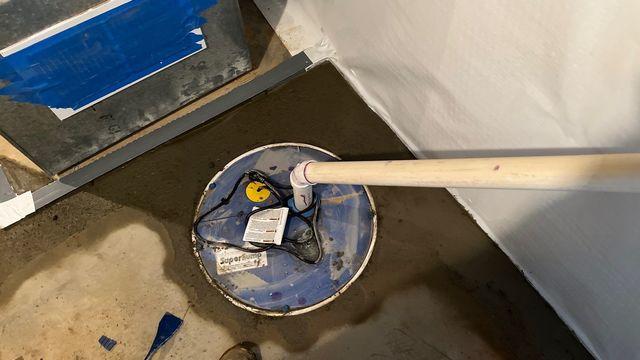 The sump pump was installed including a Water Alarm to alert the homeowner if excessive water covers the lid.  This will discharge water out of the home when needed.