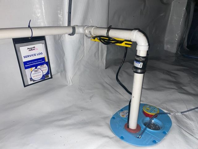 A sump pump carries excess water out of the crawlspace. This keeps the area nice and dry.