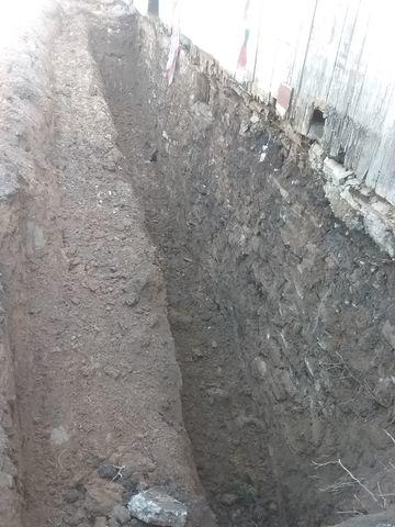 The exterior of the wall is excavated, installation can begin