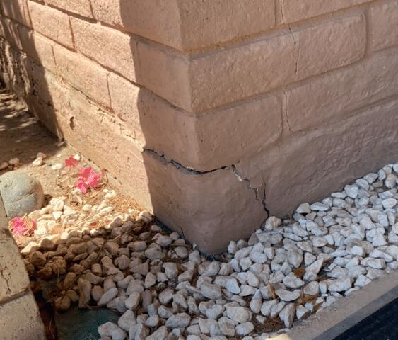 Symptoms of Corrosion Problems in a Stem Wall: Spalling Concrete