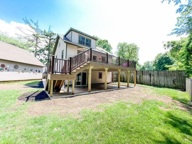 This deck equipped with composite decking, a retractable awning and aluminum railings is essential for having the best a deck can offer.