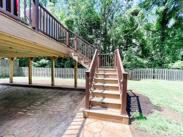 These deck steps equipped with aluminum railings as well as recessed lighting make the deck nice to enjoy at night.