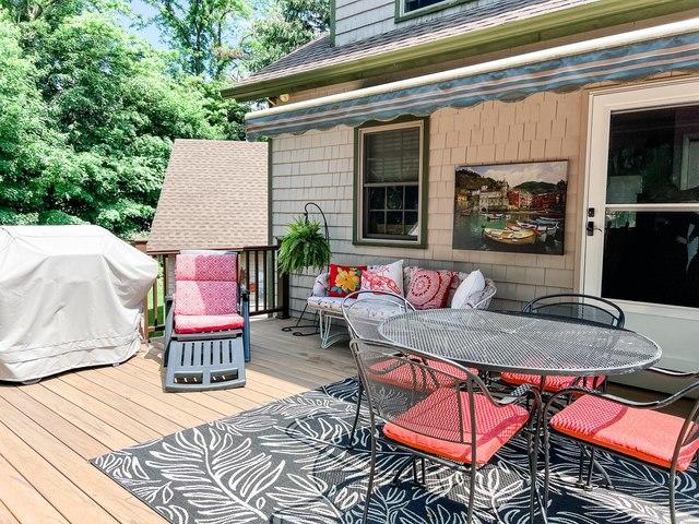 Clients can enjoy their space under the shade of this retractable awning.