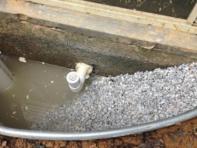 Here you can see the outside of our job, here is the pipe that runs inside. This pipe will take the water that would have previously seeped into the home and create a path of least resistance for the water to flow into the pipe and into the sump.