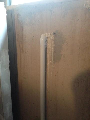 This is a picture of the pipe that runs on the inside of the foundation with the injection foam around it.