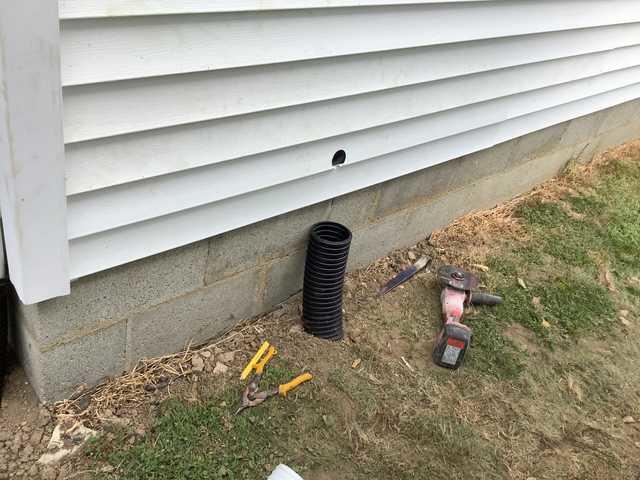 We began our project by installing 106 linear feet of drain tile around perimeter of crawlspace and tied into a SuperSump with a Zoeller M98 sump pump. We discharged that plumbing to the outside through an IceGuard that runs to a 15 foot underground downspout. To combat the heavy areas of mold, we sprayed Mold-X.

To help manage moisture and humidity, we installed a CleanSpace Encapsulation System over exterior walls, across the floor, and around existing pilasters. The encapsulation system was buttoned along the walls, with all seams on the walls and floor overlapped, then sealed with urethane, and secured with industrial tape. 

To help support the structure, we installed a new beam on existing support columns and pocket. We also sistered floor joists with new lumber. 

Finally, we installed an AprilAire E100 and drained that into the SuperSump.