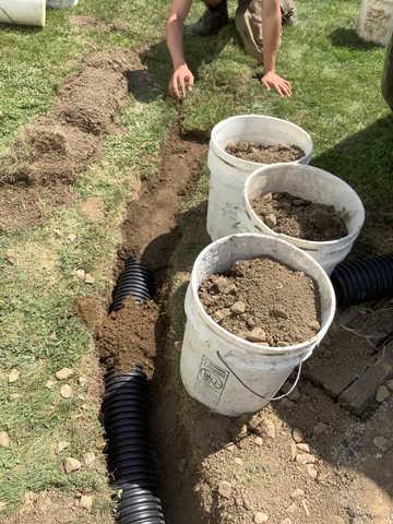 We began our project by installing 106 linear feet of drain tile around perimeter of crawlspace and tied into a SuperSump with a Zoeller M98 sump pump. We discharged that plumbing to the outside through an IceGuard that runs to a 15 foot underground downspout. To combat the heavy areas of mold, we sprayed Mold-X.

To help manage moisture and humidity, we installed a CleanSpace Encapsulation System over exterior walls, across the floor, and around existing pilasters. The encapsulation system was buttoned along the walls, with all seams on the walls and floor overlapped, then sealed with urethane, and secured with industrial tape. 

To help support the structure, we installed a new beam on existing support columns and pocket. We also sistered floor joists with new lumber. 

Finally, we installed an AprilAire E100 and drained that into the SuperSump.