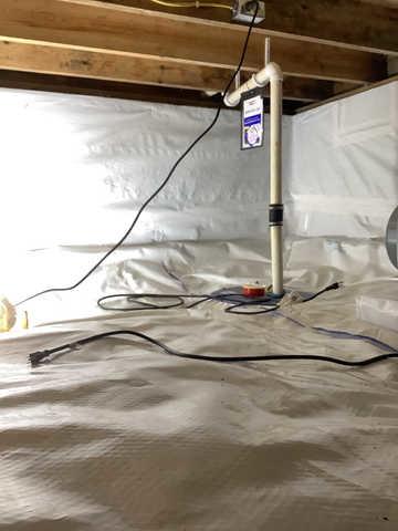 We began our project by installing 106 linear feet of drain tile around perimeter of crawlspace and tied into a SuperSump with a Zoeller M98 sump pump. We discharged that plumbing to the outside through an IceGuard that runs to a 15 foot underground downspout. To combat the heavy areas of mold, we sprayed Mold-X.

To help manage moisture and humidity, we installed a CleanSpace Encapsulation System over exterior walls, across the floor, and around existing pilasters. The encapsulation system was buttoned along the walls, with all seams on the walls and floor overlapped, then sealed with urethane, and secured with industrial tape. 

To help support the structure, we installed a new beam on existing support columns and pocket. We also sistered floor joists with new lumber. 

Finally, we installed an AprilAire E100 and drained that into the SuperSump.