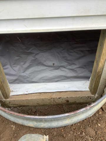 We began our project by installing 106 linear feet of drain tile around perimeter of crawlspace and tied into a SuperSump with a Zoeller M98 sump pump. We discharged that plumbing to the outside through an IceGuard that runs to a 15 foot underground downspout. To combat the heavy areas of mold, we sprayed Mold-X.

To help manage moisture and humidity, we installed a CleanSpace Encapsulation System over exterior walls, across the floor, and around existing pilasters. The encapsulation system was buttoned along the walls, with all seams on the walls and floor overlapped, then sealed with urethane, and secured with industrial tape. 

To help support the structure, we installed a new beam on existing support columns and pocket. We also sistered floor joists with new lumber. 

Finally, we installed an AprilAire E100 and drained that into the SuperSump.