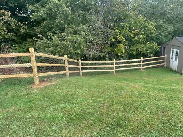 3 Rail Split Rail with Chain Link on the inside Natural / Brown Pressure Treated Wood / Chain Link / (2) 4' gates / (2) 8' double gate / Bottom Tension wire / Brown Chain Link Added to the inside of the split rail