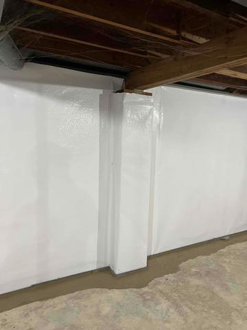 The WaterGuard floor drainage system installs on top of the footer to collect water passing through the floor, wall, and where the footer meets the wall and floor.