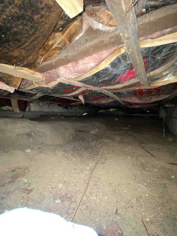 This crawlspace was filled with moisture and some water seepage from the walls.