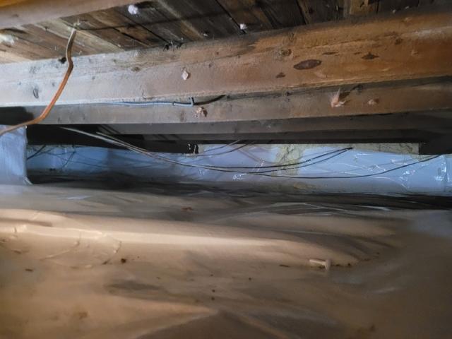 Our CleanSpace vapor barrier is lined along the wall and floor of the crawlspace to keep moisture out.