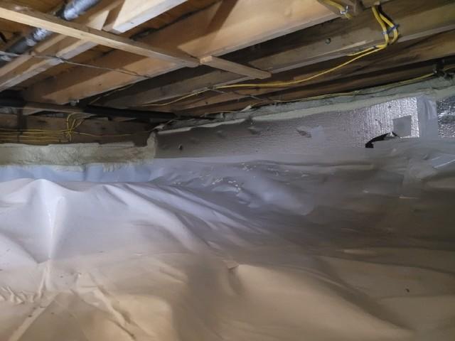 The crawlspace was lined with CleanSpace vapor barrier so that the cold ground won't bring moisture into the area.