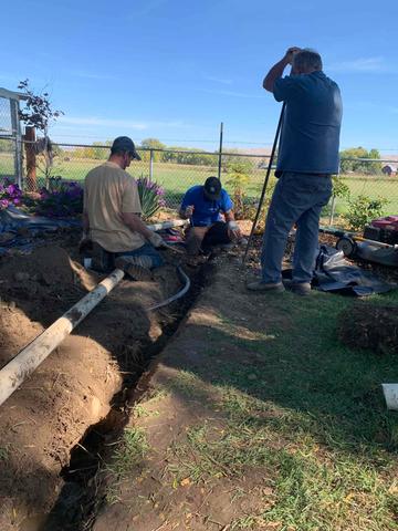 Here is our crew digging to put our SumpPump drainage system in the yard. To help Keep the water out