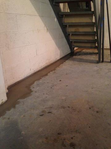 This image shows the WaterGuard flowing seamlessly under the staircase, not compromising the effectiveness of the system.