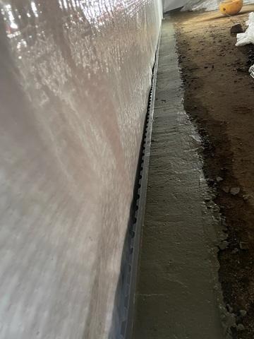 A trench is dug around the perimeter of the basement to help the water get out.