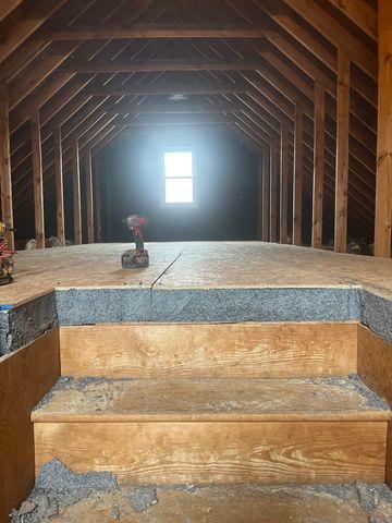 Here you can see the floor insulation for this attic deck.  This allows for ample storage and walking space in addition to great insulation for the attic and home living areas below.