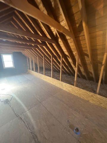 Finished and ready for use, this attic decking and cat walk allow has a clear barrier between the side spaces and the inner area of the attic.