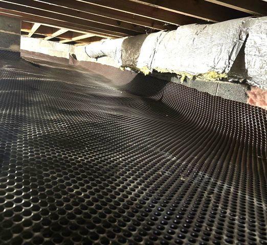 Covering the dirt floors with this material allows for air passage below but keeps the moisture from the floors away from the rest of the air in the crawl space.