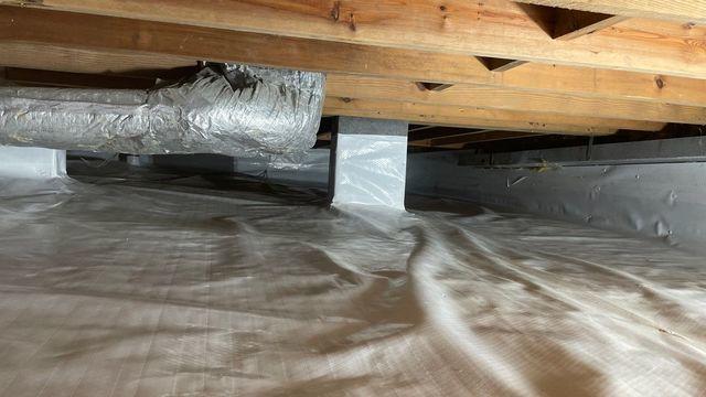 Clean Space is the final layer that covers the flooring, walls and pillars of the foundation.  This waterproofing cover helps make the crawl space dry and useable for storage if needed.