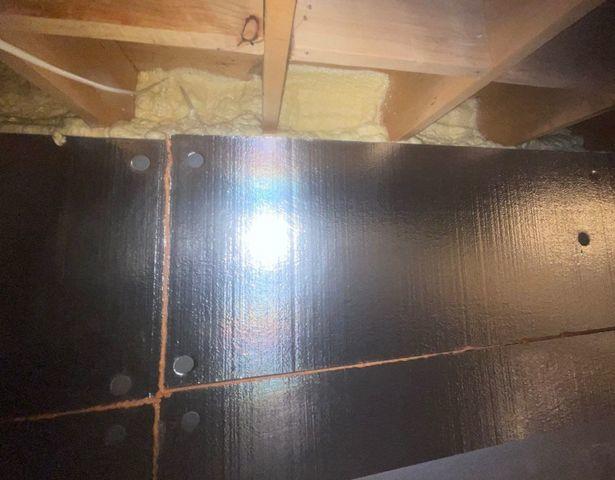 Silver Glo insulation panels cover the walls of this crawl space and spray foam seals up the rim joists to keep out any unconditioned, external air.