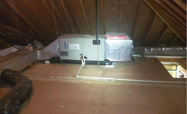 Image of attic not properly insulated.