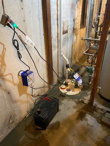 TripleSafe Sump Pump Discharging Water