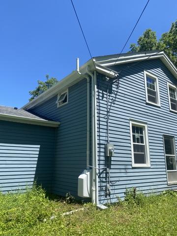 We were able to tuck this system nicely next to the downspout and put a cover on the fan to help the home aesthetically.