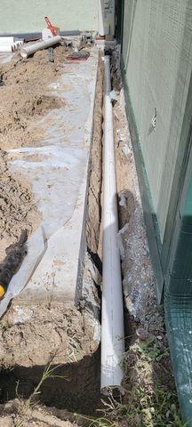 Hard Pipe Installed Under Channel Drain