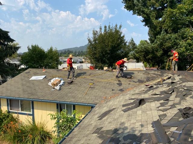 Our crew removing the old shingles.