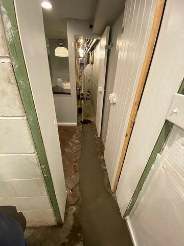 Under the wet concrete is our WaterGuard system. This is a drainage tunnel that allows water to be collected from the walls and cold joint, and sends it to the sump pump. The sump pump then discharges it out of the home at a safe distance.