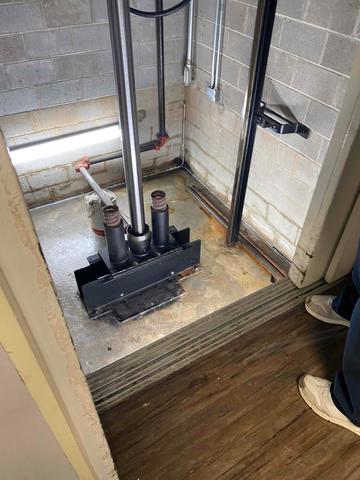 This elevator shaft had water seeping into it, rusting the exposed metal parts of the elevator. It was time to get a waterproofing system installed.