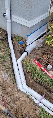 EZ Flow materials are installed into the plant bed near the home. An alternative to traditional "stone and pipe" drainage systems, EZ Flow is highly durable and prevents water from flooding the area.