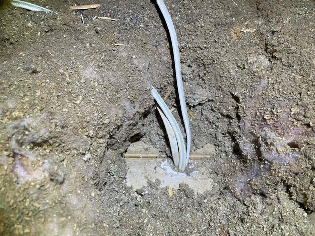 Wires in attic floor buried in the dirty insulation